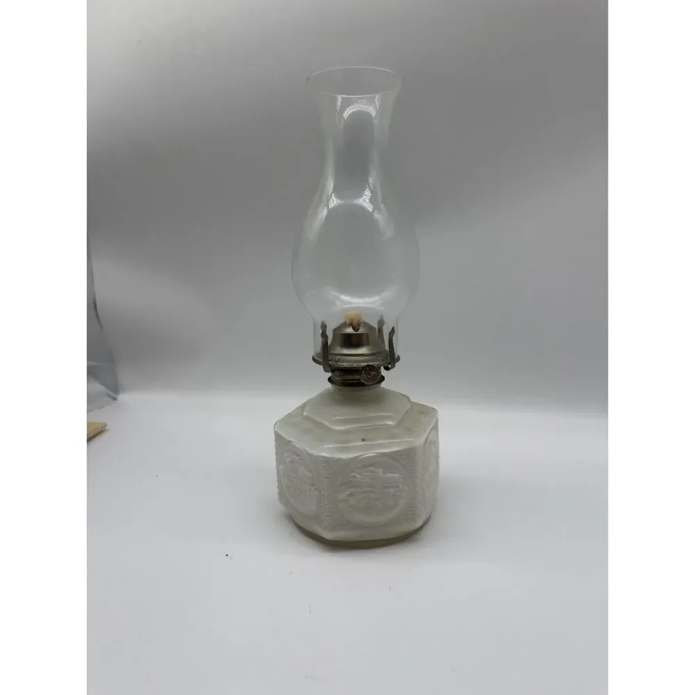 vintage oil lamp featuring a hexagonal base embossed  a horse and buggy scene